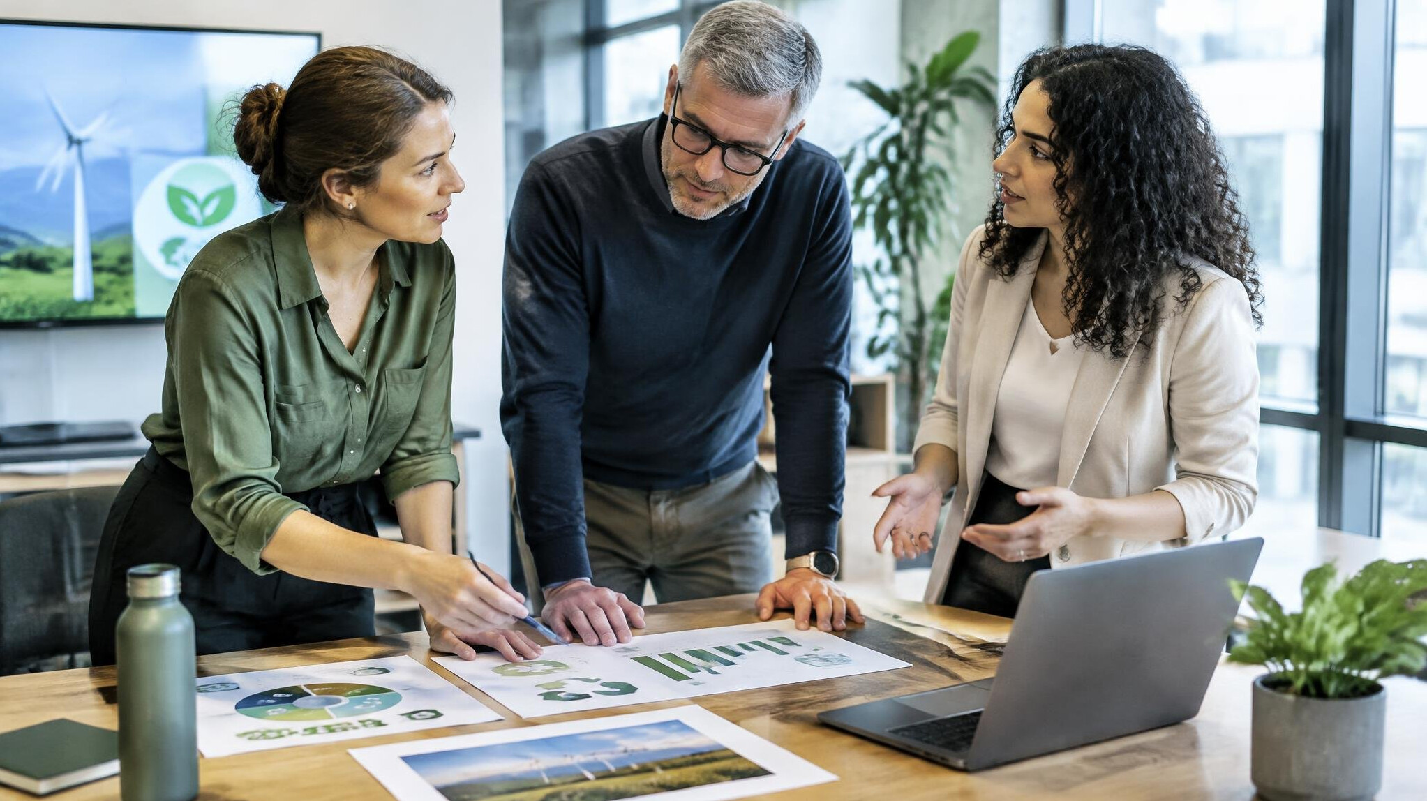 Business team discussing sustainability strategy in office